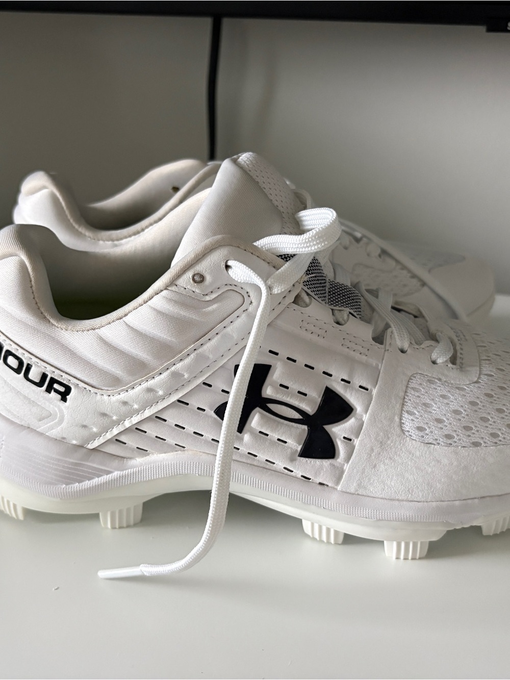 Under Armour White Kids Baseball Cleats with Black Logo